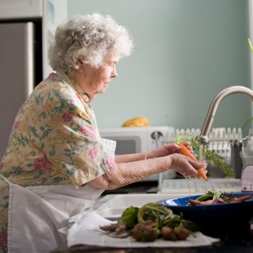 Woman washing veggies