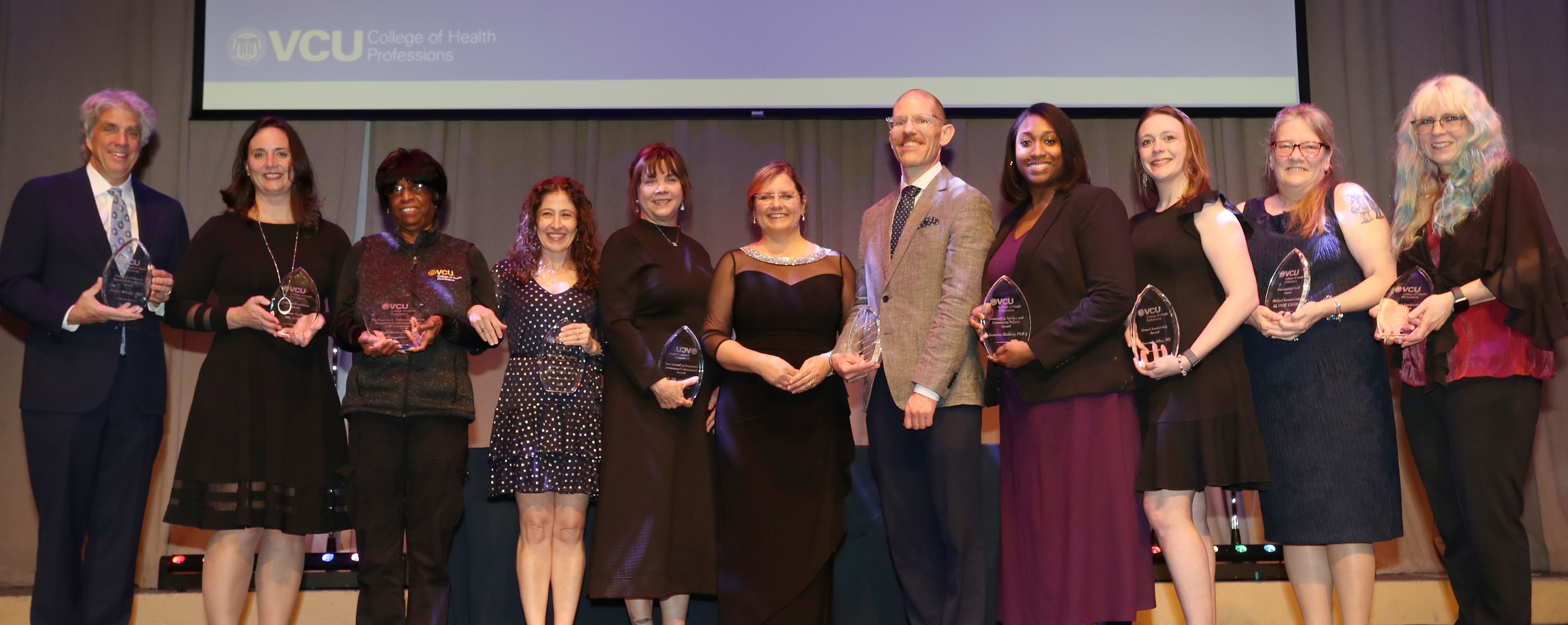 Left to right: Adam Atherly, Jaime Smiley, Francine Coleman, Lauren Andelin, Gigi Amateau, Dean Amy Darragh, Mike Forder, Jasmine Slattery, Amanda Alley, Mrs. Kammerman, Laurie Cathers