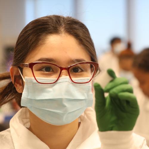 MLS student holding a sample