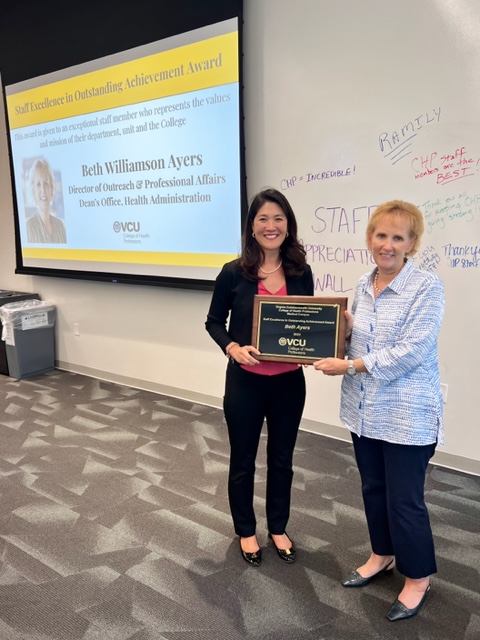 Paula Song presenting Beth Ayers with Staff Excellence Award