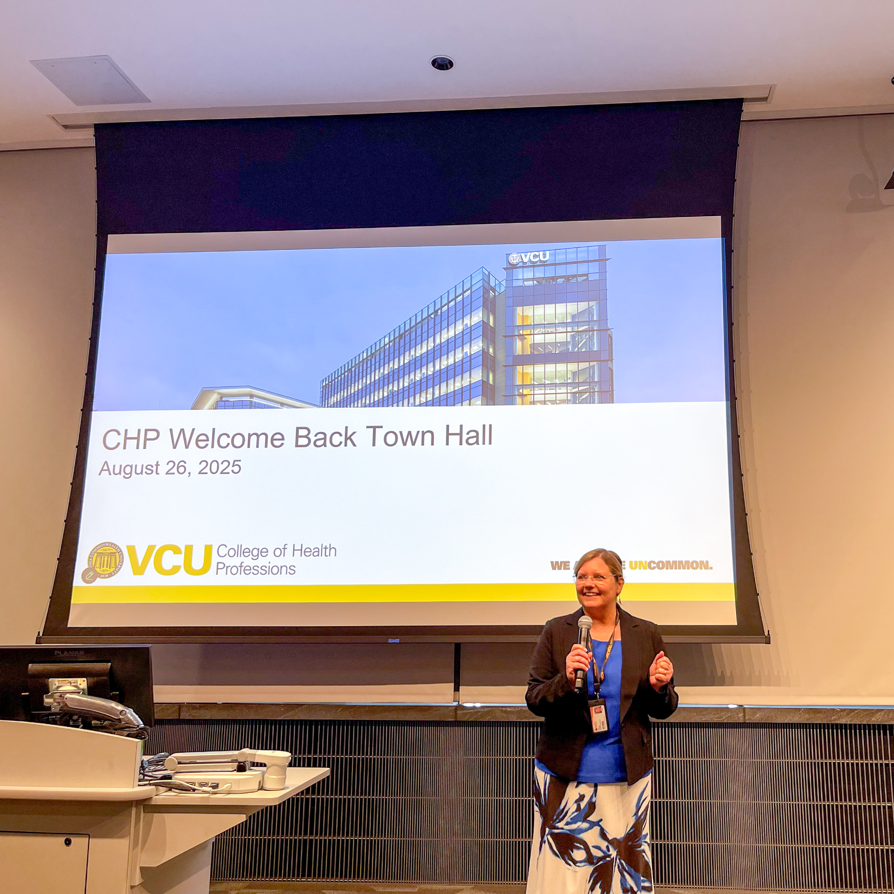 Amy R. Darragh, Ph.D., dean of the College of Health Professions, is all smiles as she kicks off the CHP Welcome Back Town Hall.