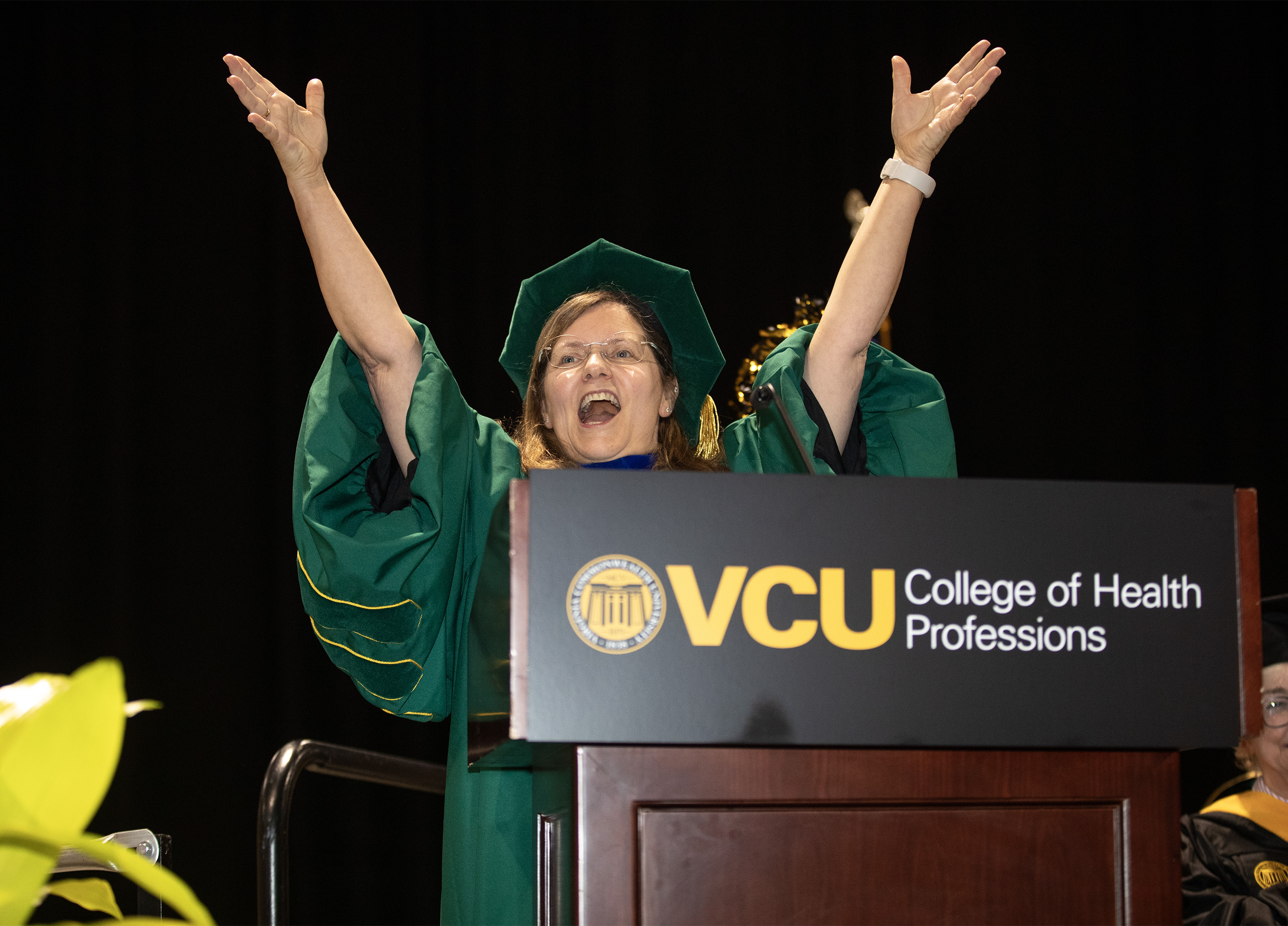 Dean Amy Darragh cheering the CHP graduates on.