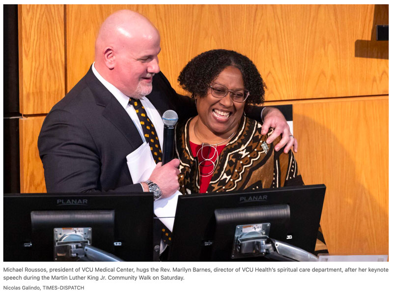 Michael Roussos, president of the VCU Medical Center, hugs the Rev Marilyn Barnes, director of VCU Health's spiritual care department, after her keynote speech during the MLK Jr Community Walk on Saturday Nicolas Galindo TIMES-DISPATCH