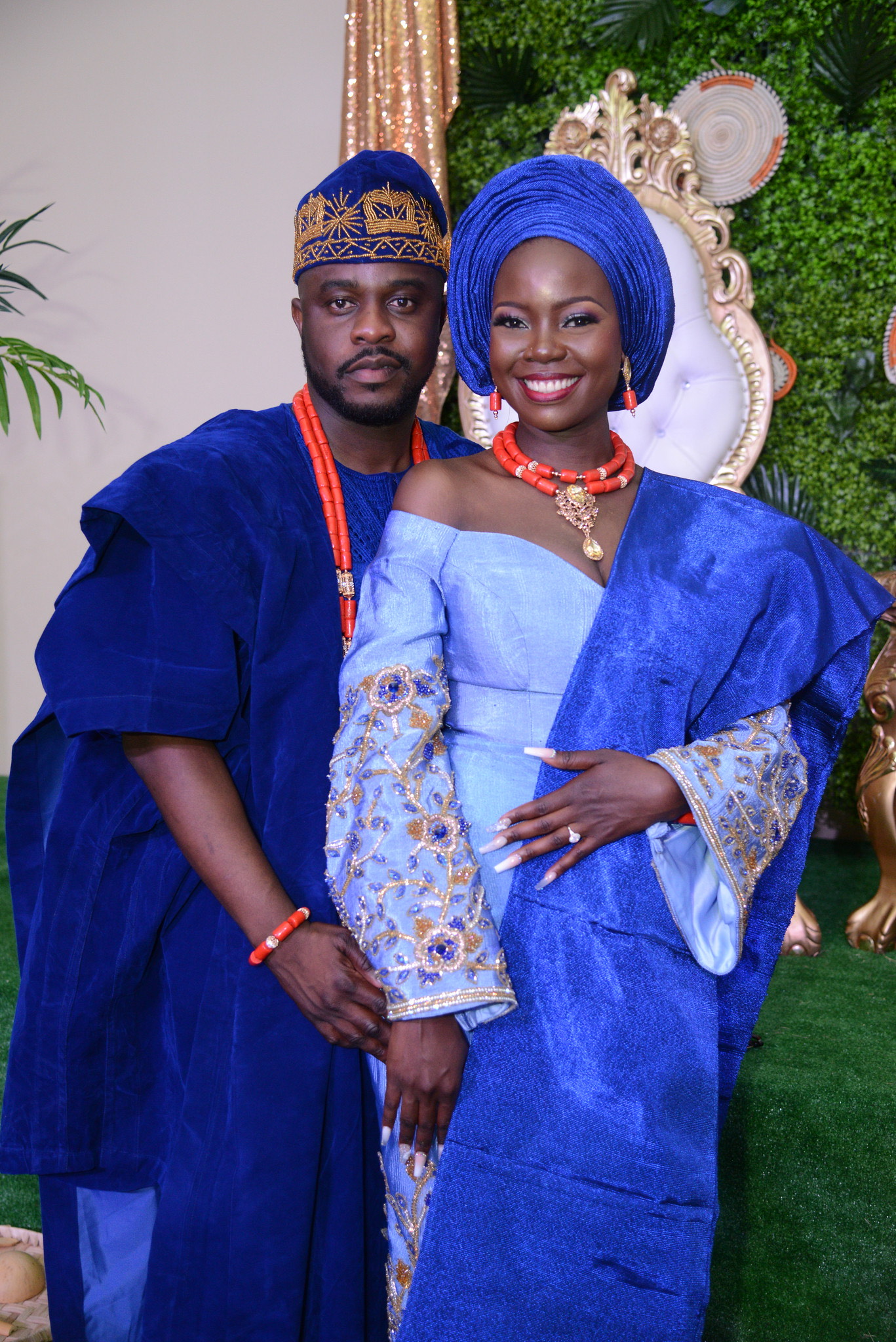 Modesola Akala and spouse dressed in blue at their wedding