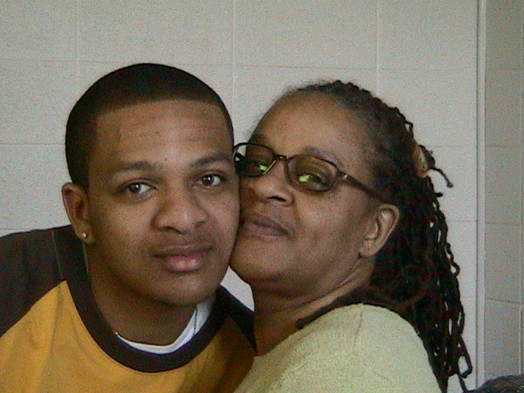 Williams during his sophomore year in college with his mother in 2005.
