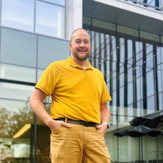 Brent Sprouse standing in front of the College of Health Professions
