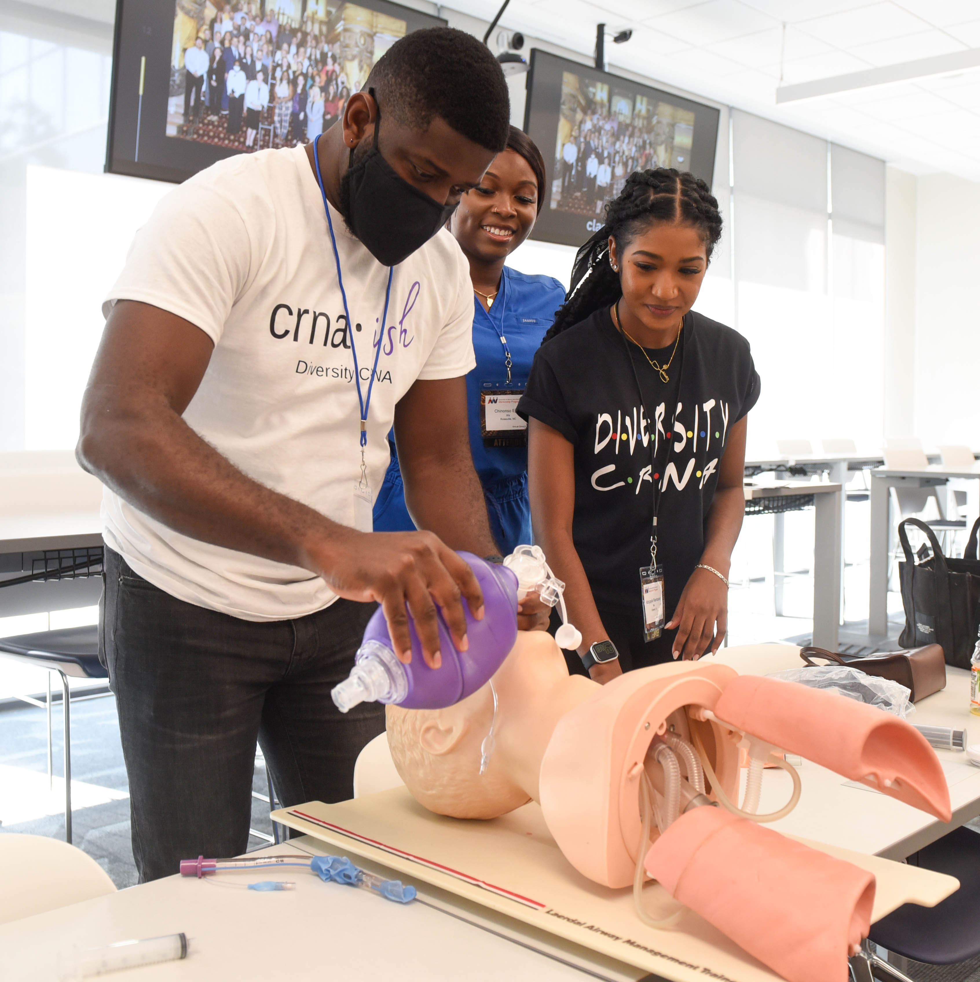 Students ventilating mannequin