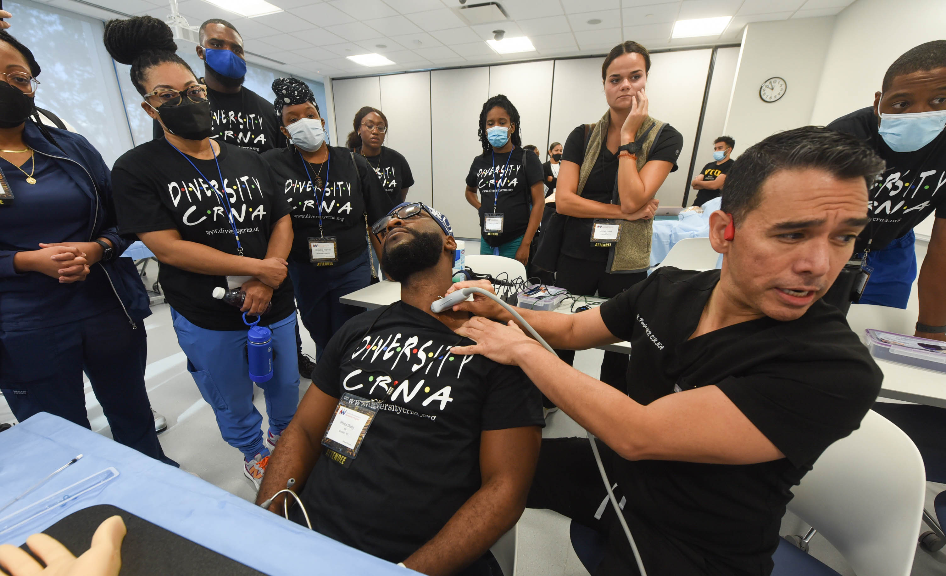 Group of students watch ultrasound demonstration.