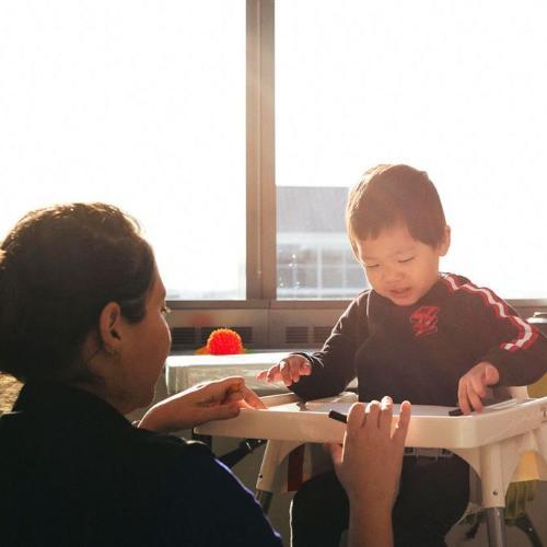 Occupational therapist testing child reflexes