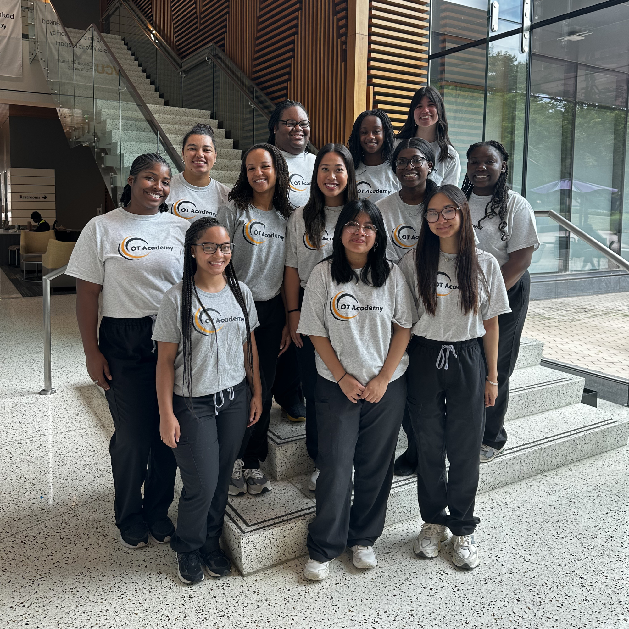 OT Academy participants on the stairs for a group photo