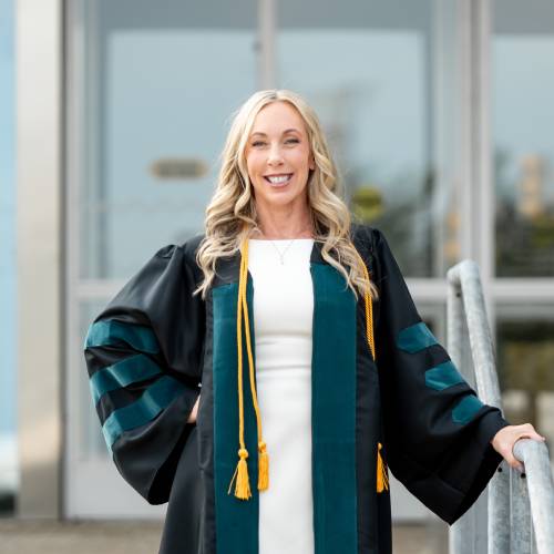 Feather Wright wearing Graduation gown