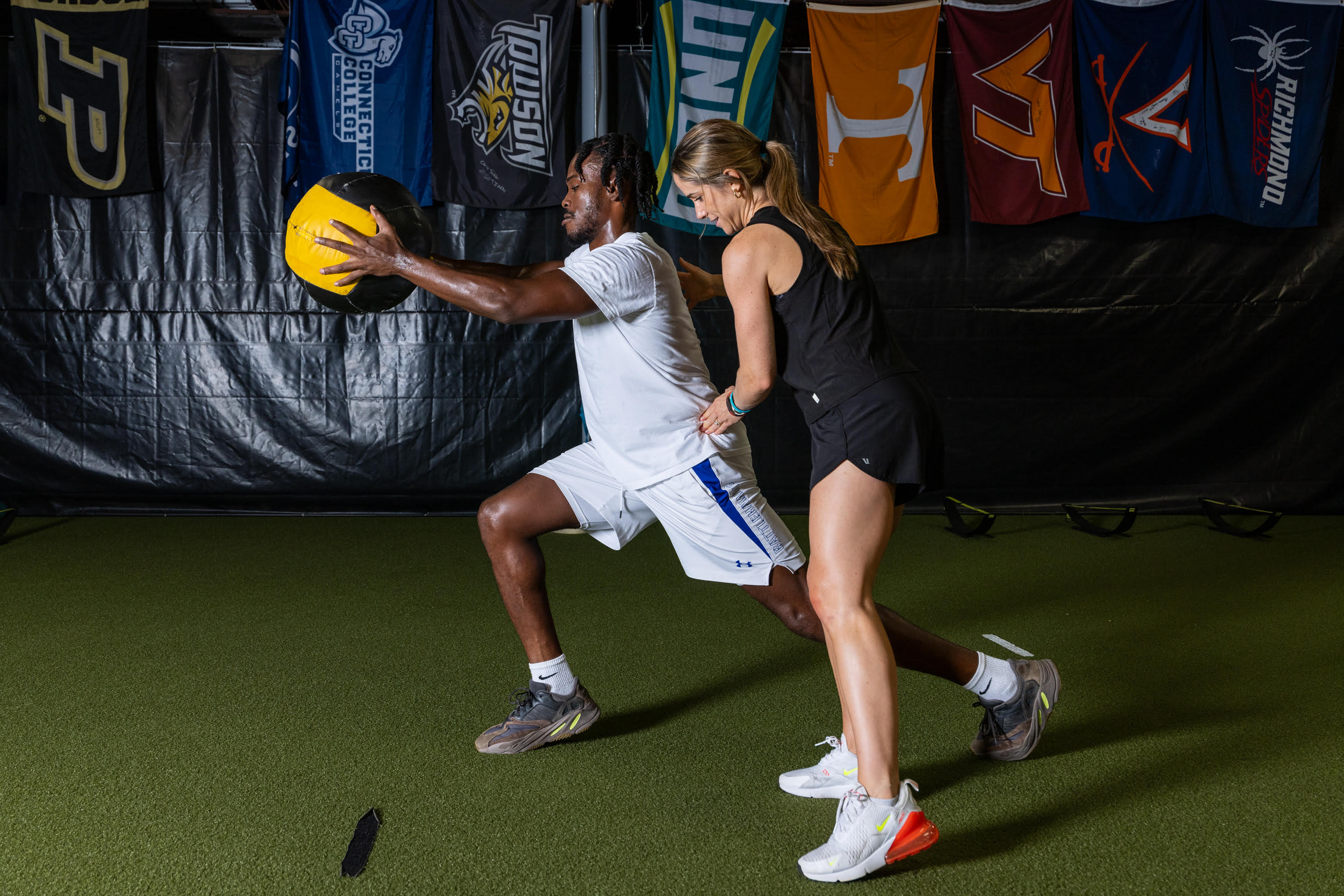 Gabby helping patient through physical therapy