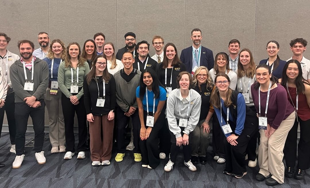 PT faculty and students at the APTA conference in a group photo