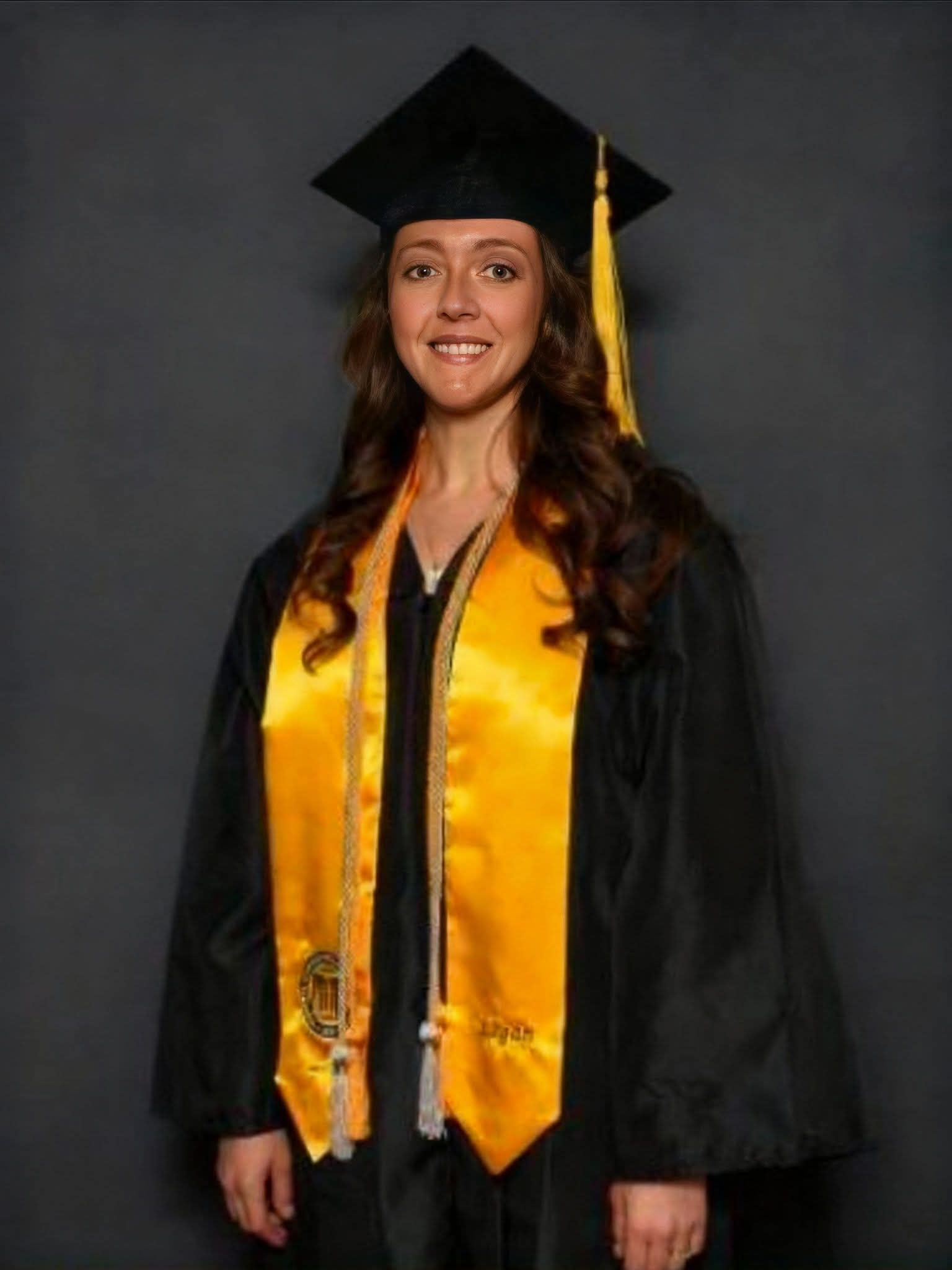 Graduate Emily Ferguson in cap and gown