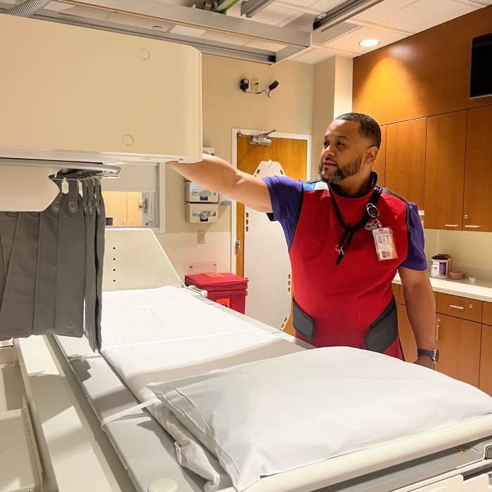 Joe McCampbell in clinic with radiation machines