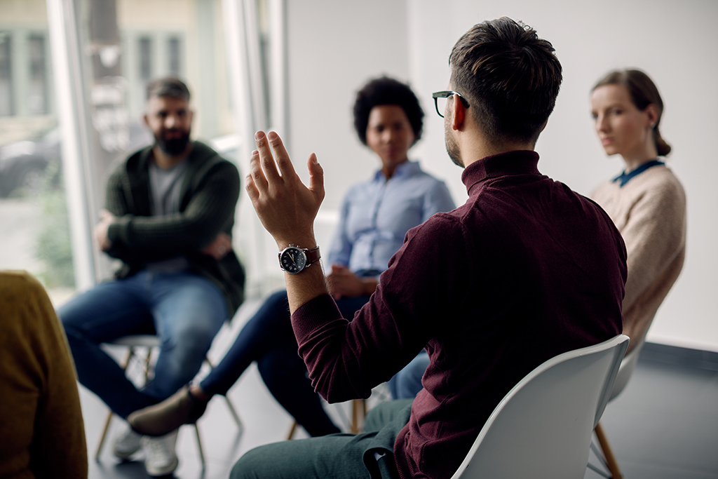 Group sitting in a circle talking